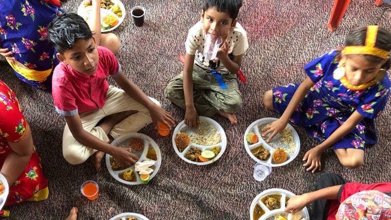 Kids in Nepal eating lunch